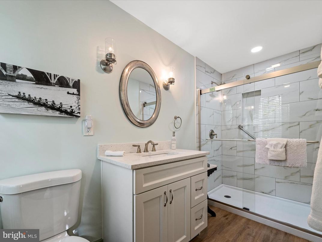 Bathroom, Glass Shower, Interior, Marble Walls, Recessed Lighting, Wood Texture Flooring