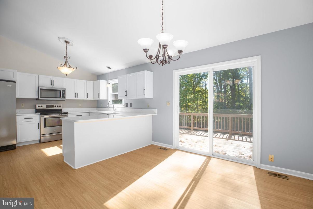 Chandelier, Interior, Kitchen, Pendant Lights, Stainless Steel Appliances, Wood Texture Flooring