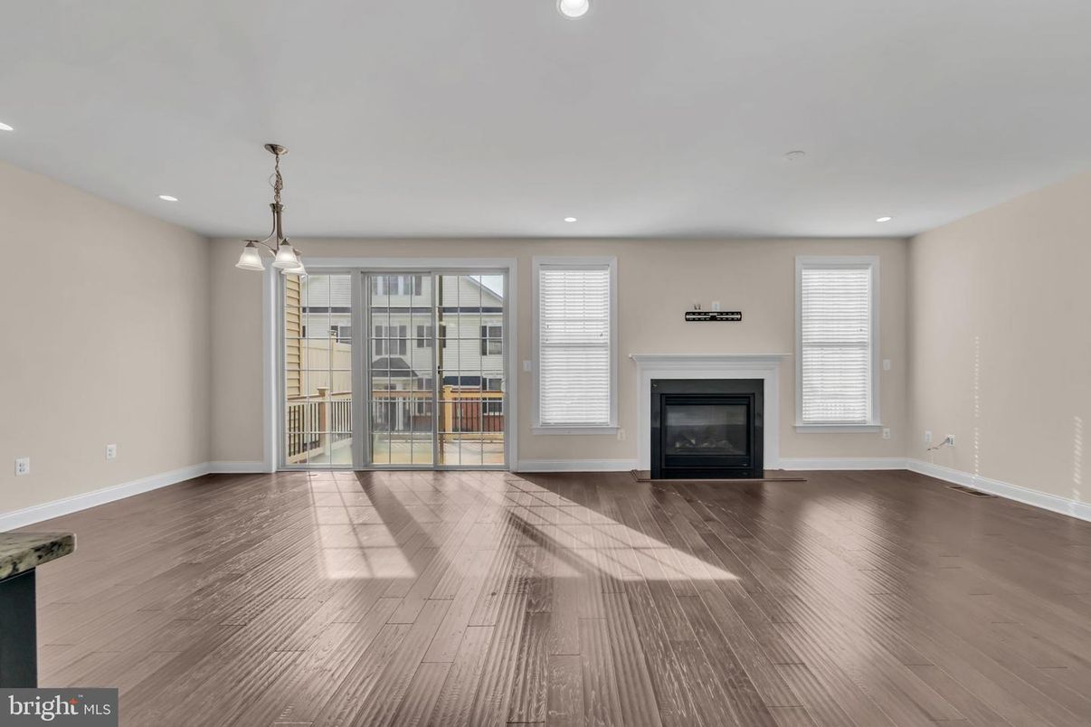 Empty room, Fireplace, Interior, Pendant Lights, Recessed Lighting, Wood Texture Flooring
