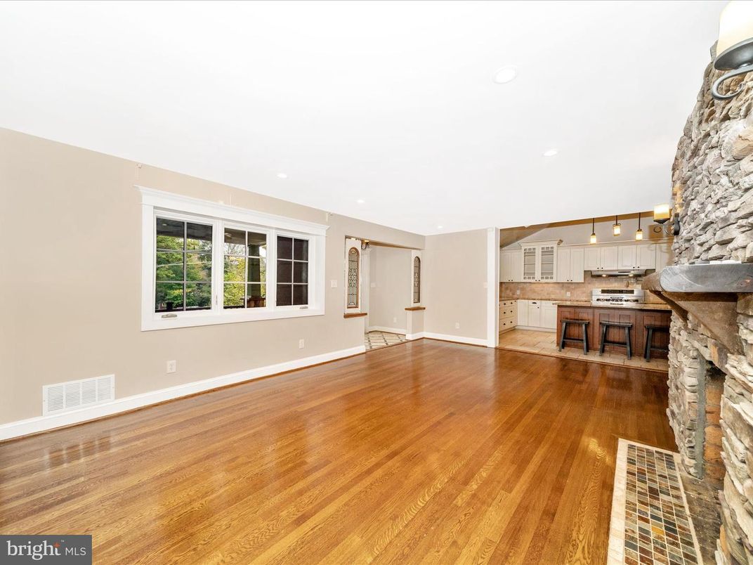 Empty room, Fireplace, Interior, Kitchen, Pendant Lights, Recessed Lighting, Stone Walls, Wood Texture Flooring