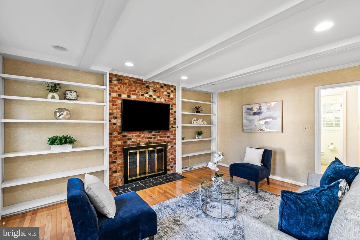 Fireplace, Interior, Living room, Recessed Lighting, Stone Walls, Wood Texture Flooring