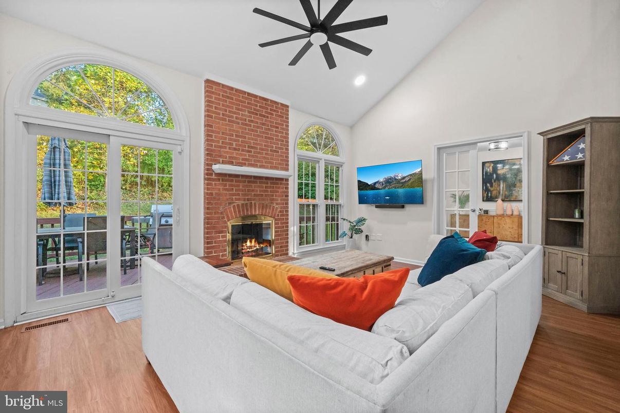 Fireplace, Interior, Living room, Recessed Lighting, Stone Walls, Wood Texture Flooring