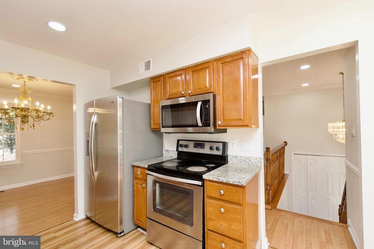Chandelier, Interior, Kitchen, Pendant Lights, Recessed Lighting, Stainless Steel Appliances, Wood Texture Flooring