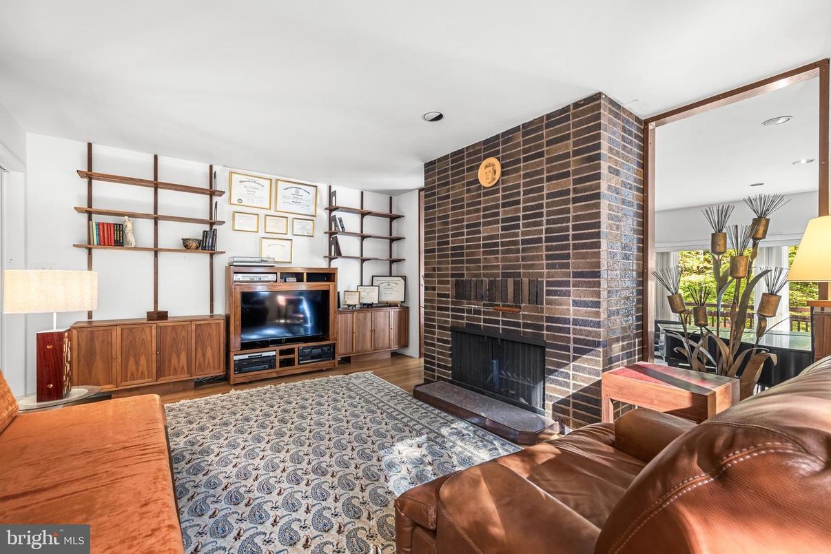 Fireplace, Interior, Living room, Recessed Lighting, Stone Walls, Wood Texture Flooring