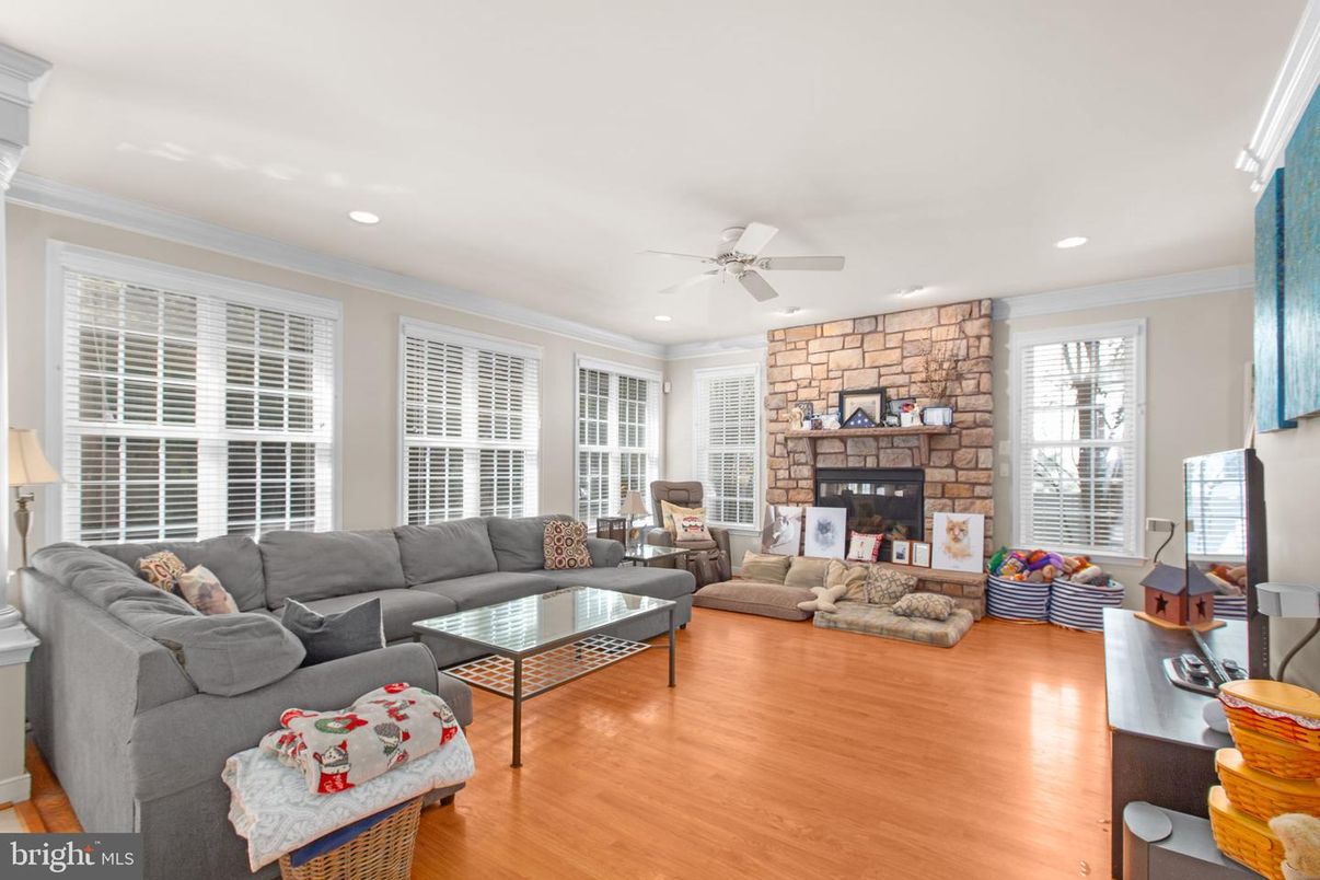 Fireplace, Interior, Living room, Recessed Lighting, Stone Walls, Wood Texture Flooring