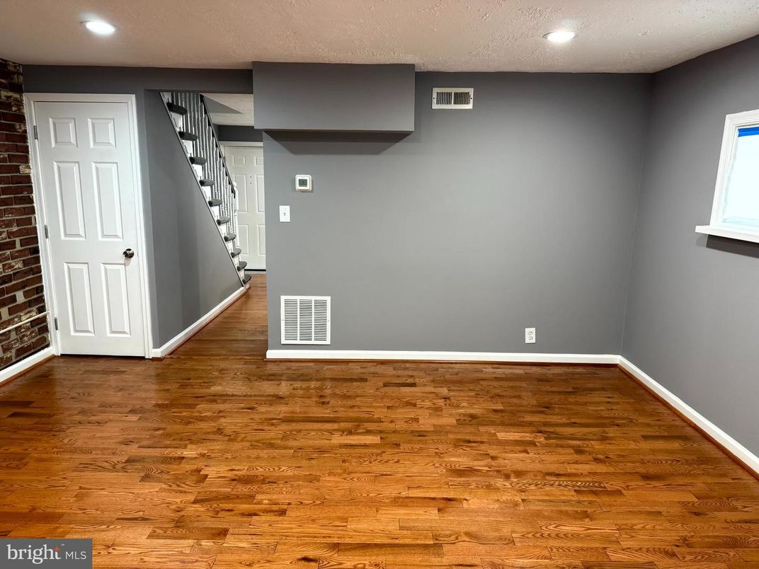 Empty room, Interior, Recessed Lighting, Stone Walls, Wood Texture Flooring