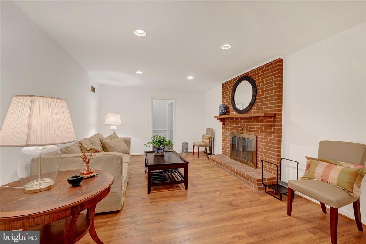 Fireplace, Interior, Living room, Recessed Lighting, Stone Walls, Wood Texture Flooring