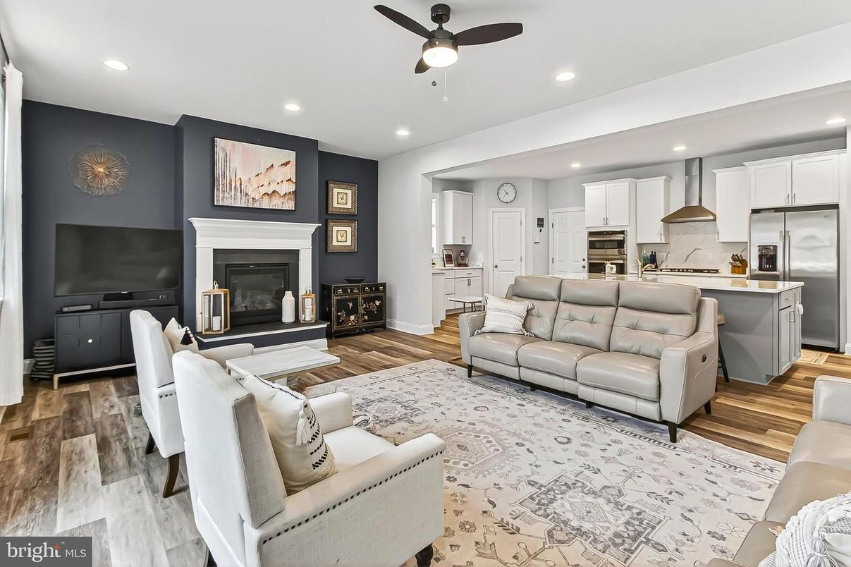 Fireplace, Interior, Kitchen, Living room, Recessed Lighting, Stainless Steel Appliances, Wood Texture Flooring