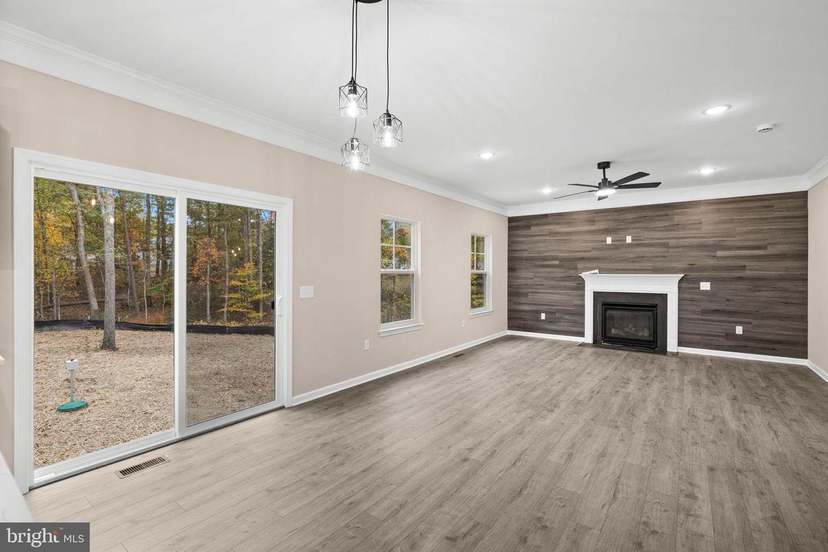 Empty room, Fireplace, Interior, Pendant Lights, Recessed Lighting, Wood Texture Flooring, Wooden Walls