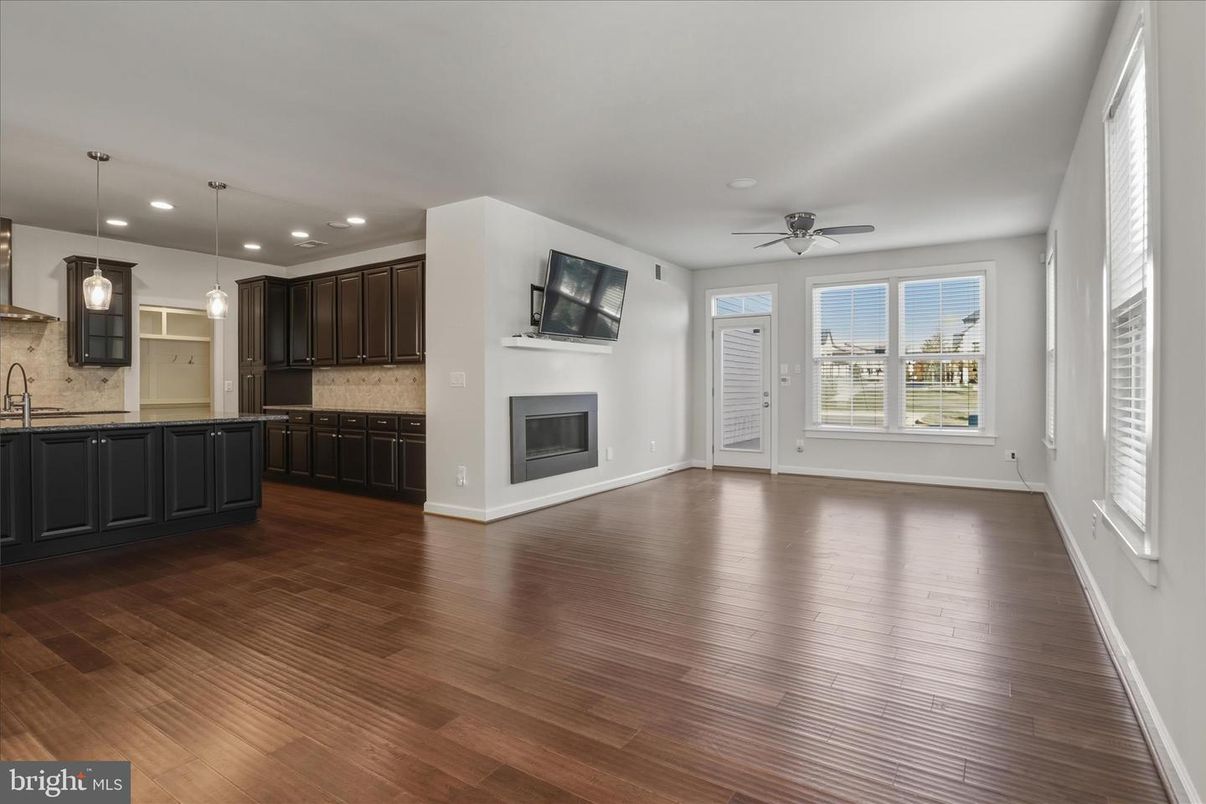 Empty room, Fireplace, Interior, Kitchen, Pendant Lights, Recessed Lighting, Wood Texture Flooring