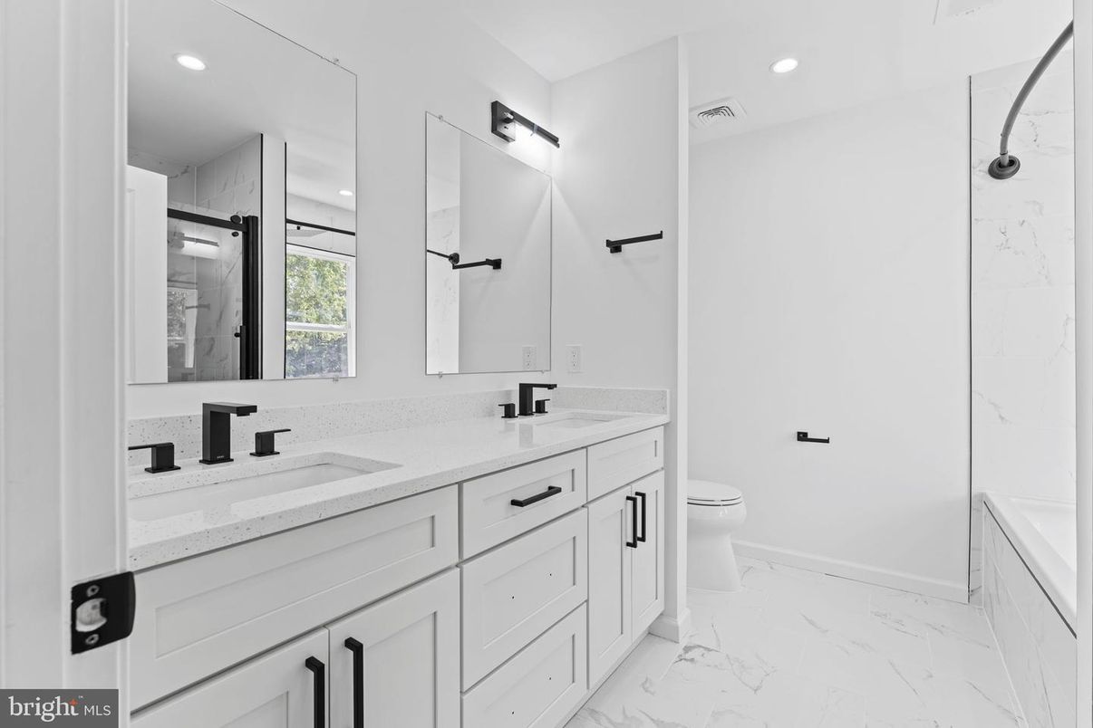 Bathroom, Dual Sink Vanities, Glass Shower, Interior, Marble, Marble Walls, Recessed Lighting