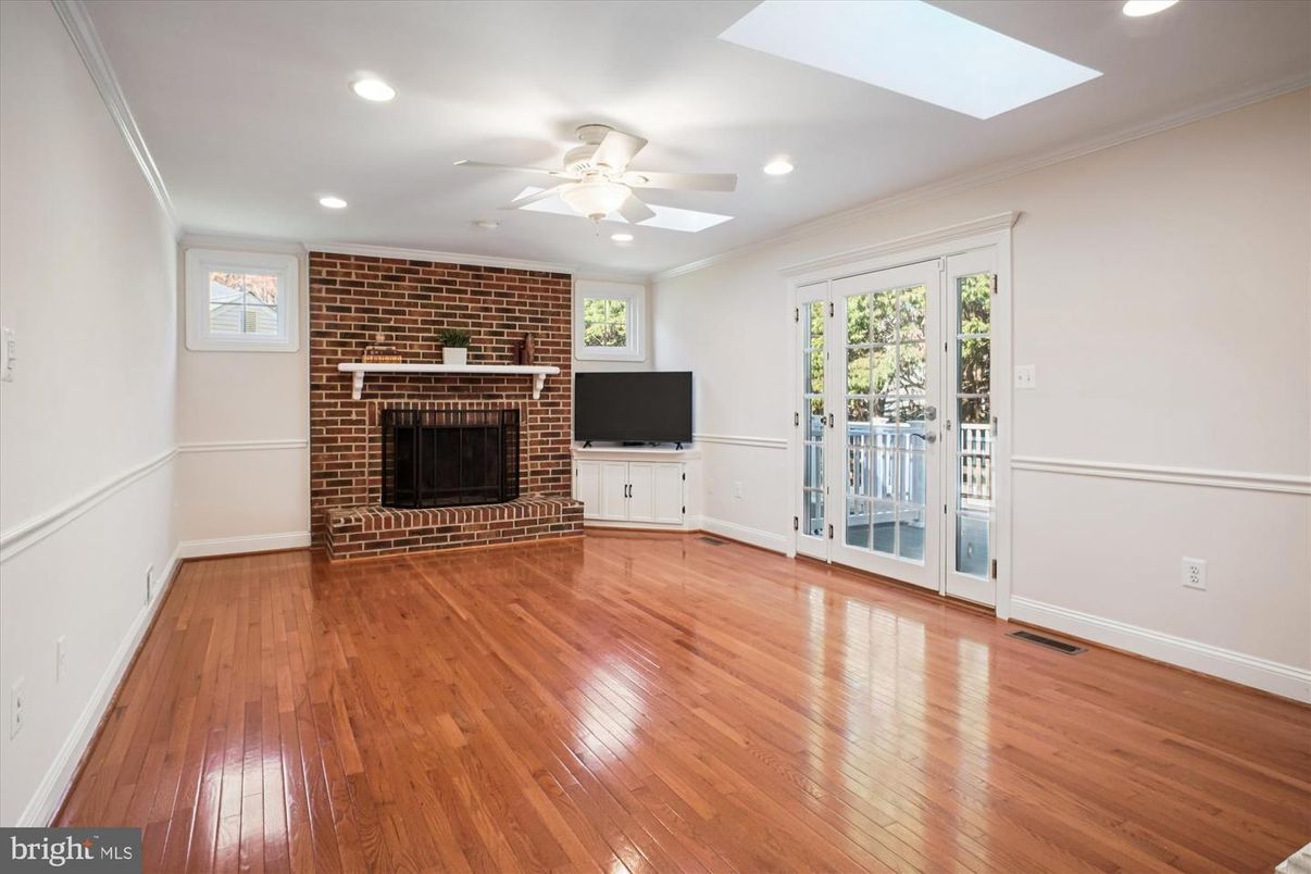 Empty room, Fireplace, Interior, Recessed Lighting, Stone Walls, Wood Texture Flooring