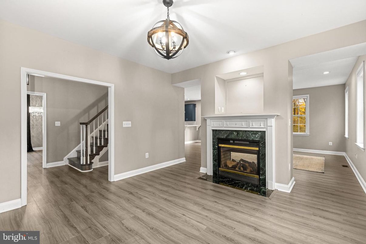 Empty room, Fireplace, Interior, Pendant Lights, Recessed Lighting, Wood Texture Flooring