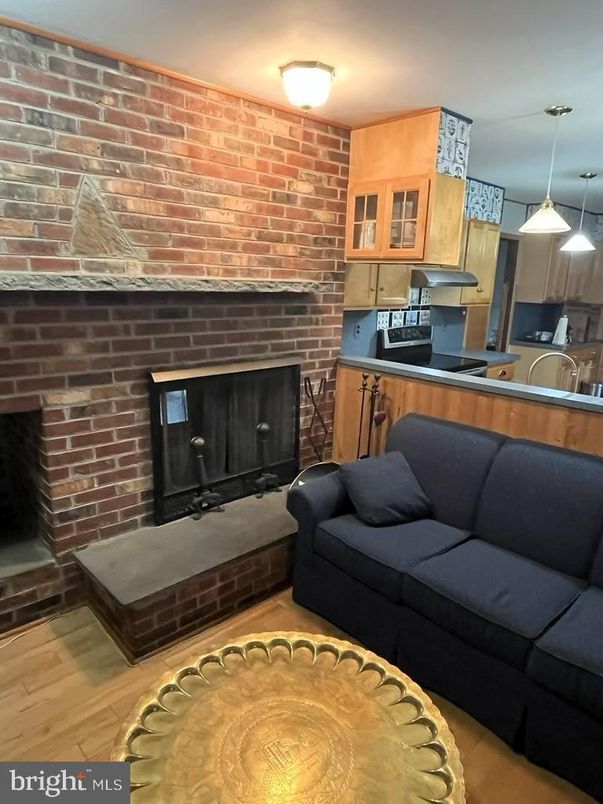 Fireplace, Interior, Kitchen, Living room, Pendant Lights, Stone Walls, Wood Texture Flooring