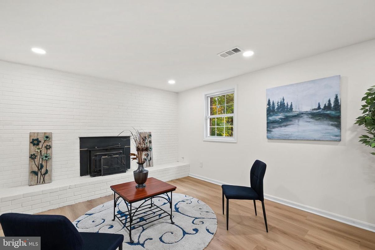 Fireplace, Interior, Living room, Recessed Lighting, Stone Walls, Wood Texture Flooring