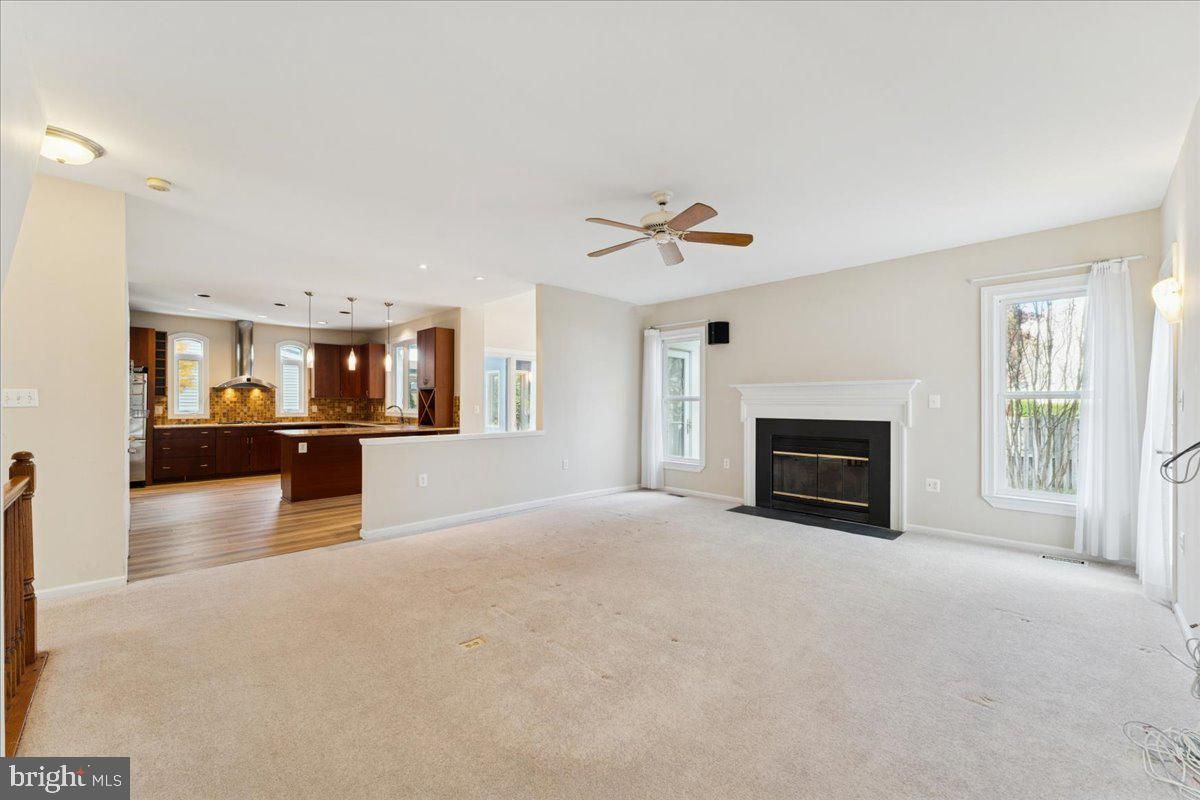 Empty room, Fireplace, Interior, Kitchen, Pendant Lights, Wood Texture Flooring