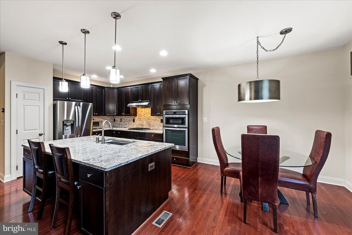 Dining room, Interior, Kitchen, Pendant Lights, Recessed Lighting, Stainless Steel Appliances, Wood Texture Flooring