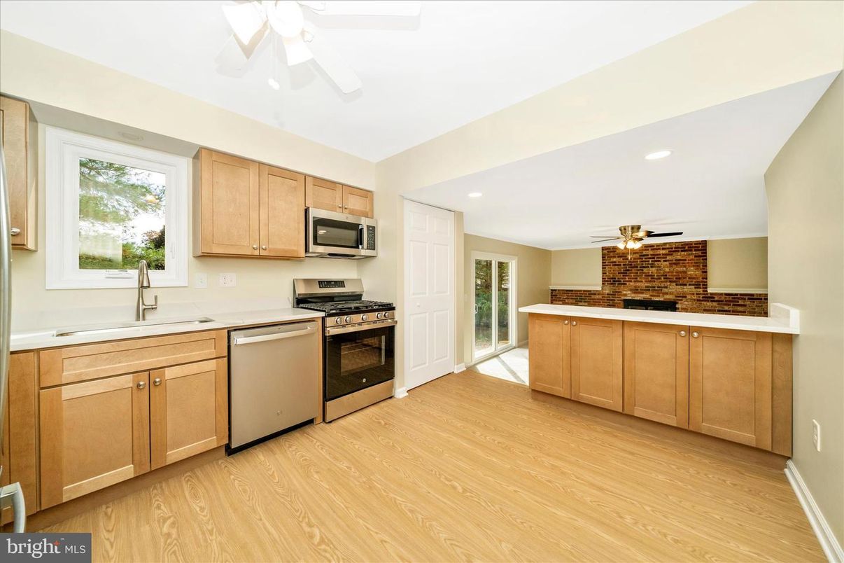 Interior, Kitchen, Recessed Lighting, Stainless Steel Appliances, Stone Walls, Wood Texture Flooring