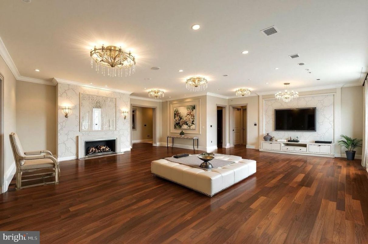 Chandelier, Fireplace, Interior, Living room, Marble Walls, Recessed Lighting, Wood Texture Flooring