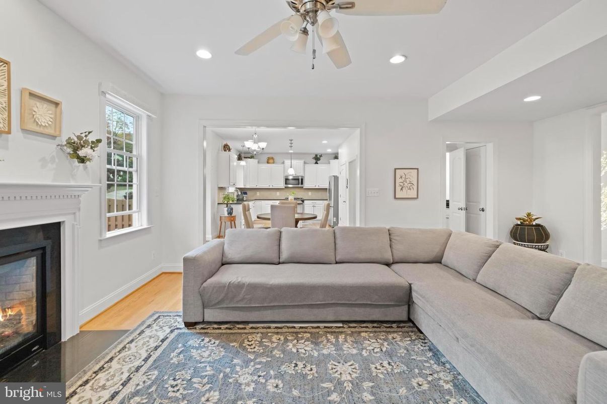 Chandelier, Dining room, Fireplace, Interior, Kitchen, Living room, Recessed Lighting, Wood Texture Flooring