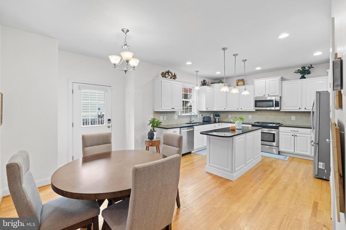 Chandelier, Dining room, Interior, Kitchen, Pendant Lights, Recessed Lighting, Stainless Steel Appliances, Wood Texture Flooring