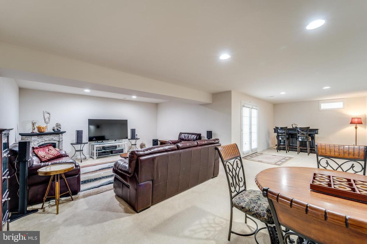 Dining room, Fireplace, Interior, Living room, Recessed Lighting, Wood Texture Flooring