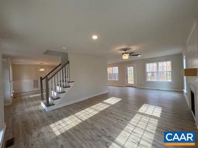 Chandelier, Empty room, Fireplace, Interior, Pendant Lights, Recessed Lighting, Wood Texture Flooring