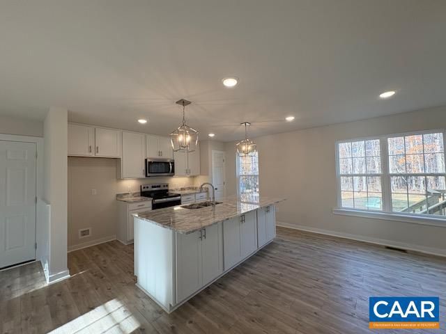 Chandelier, Interior, Kitchen, Pendant Lights, Recessed Lighting, Stainless Steel Appliances, Wood Texture Flooring