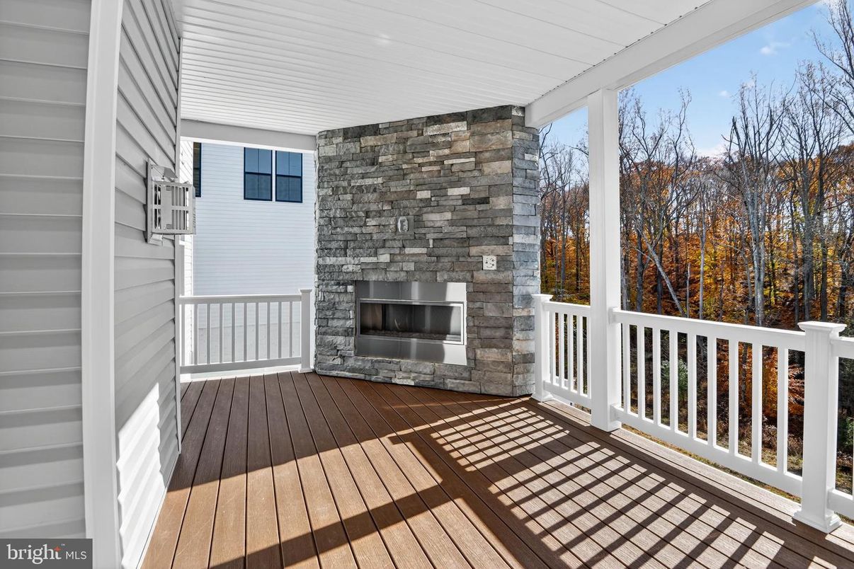 Exterior, Fireplace, Wood Texture Flooring