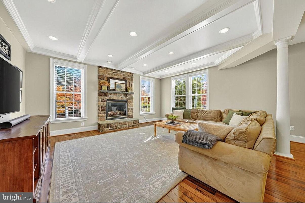 Fireplace, Interior, Living room, Recessed Lighting, Stone Walls, Wood Texture Flooring