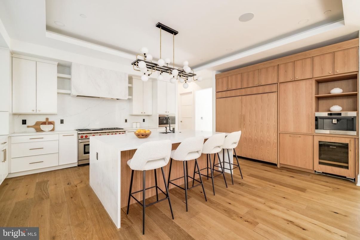 Interior, Kitchen, Marble Walls, Pendant Lights, Recessed Lighting, Stainless Steel Appliances, Wood Texture Flooring