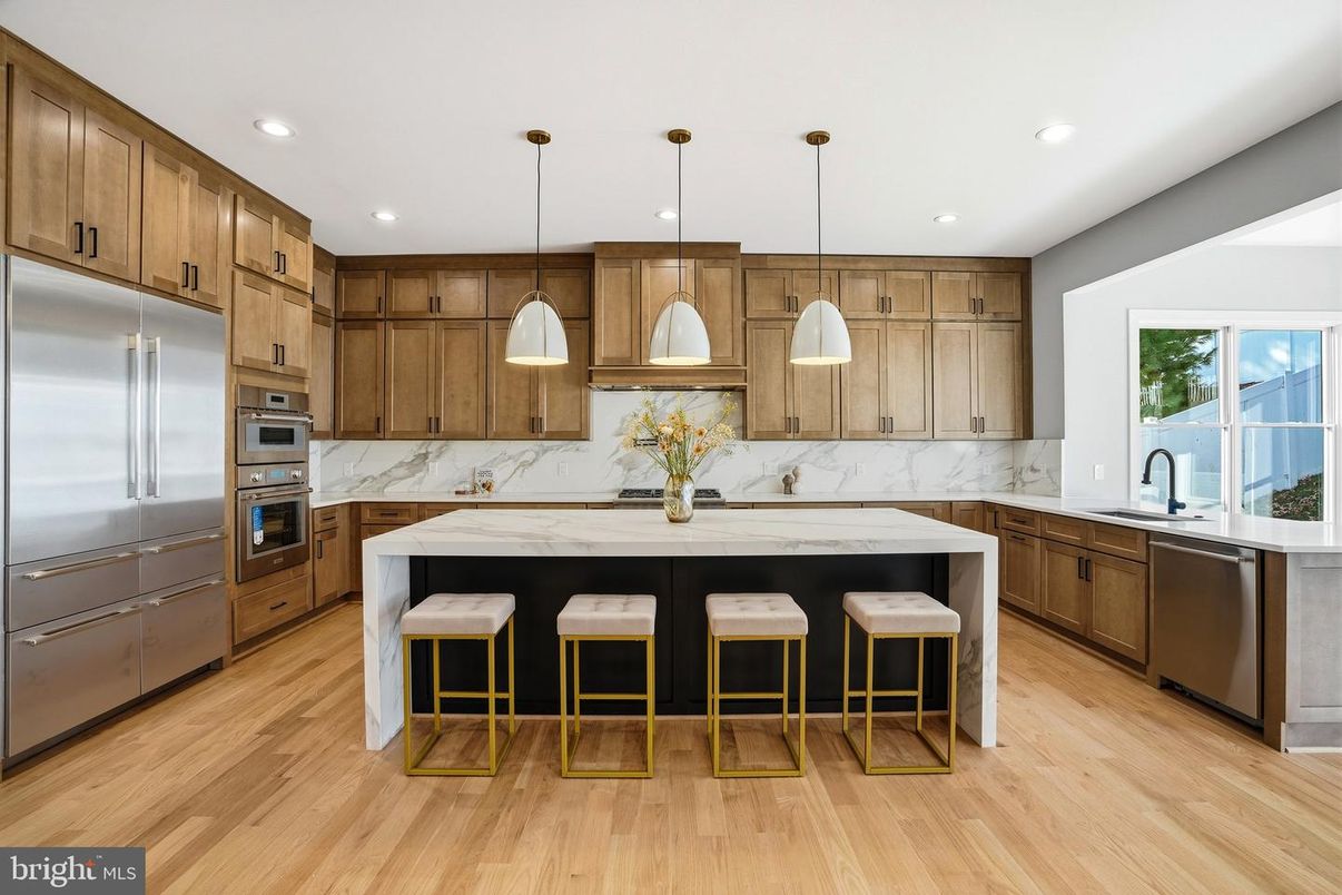 Interior, Kitchen, Marble Walls, Pendant Lights, Recessed Lighting, Stainless Steel Appliances, Wood Texture Flooring