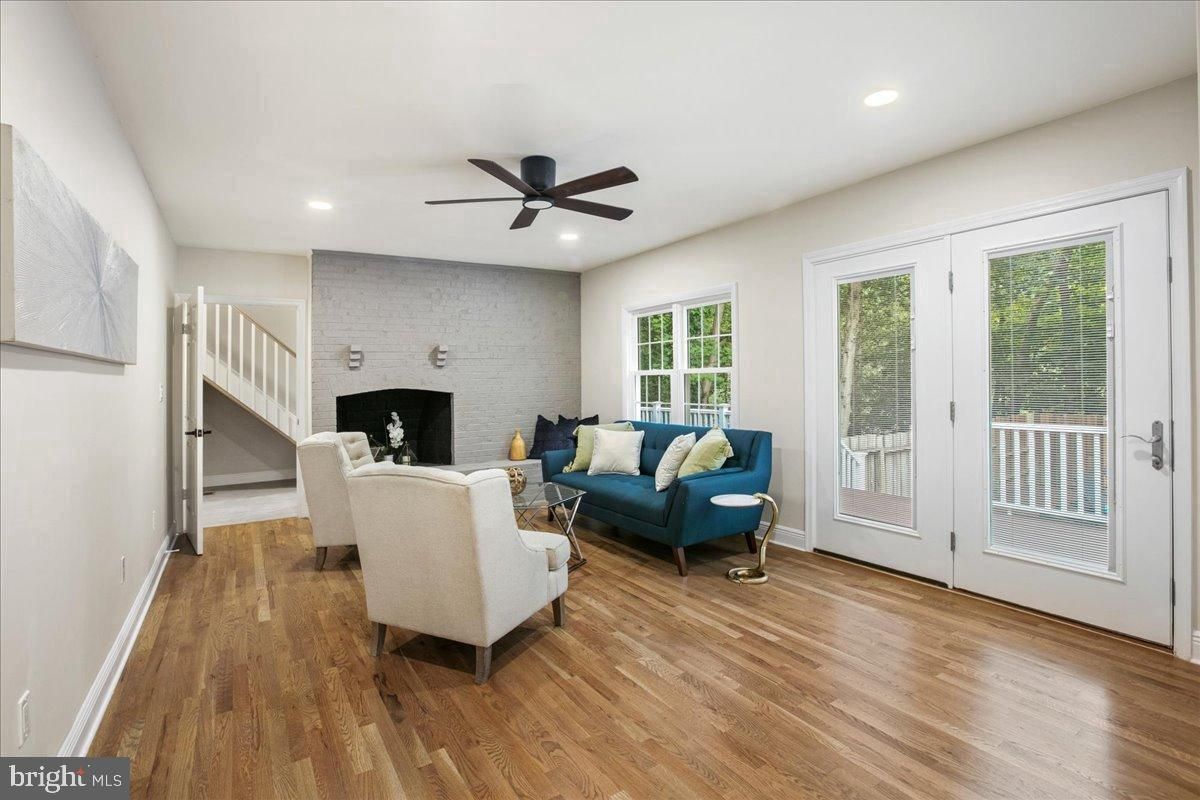 Fireplace, Interior, Living room, Recessed Lighting, Stone Walls, Wood Texture Flooring