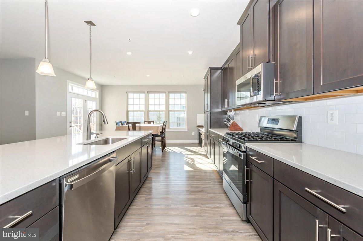 Dining room, Interior, Kitchen, Pendant Lights, Recessed Lighting, Stainless Steel Appliances, Wood Texture Flooring