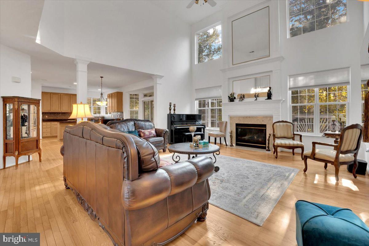 Chandelier, Fireplace, Interior, Living room, Pendant Lights, Piano, Recessed Lighting, Wood Texture Flooring