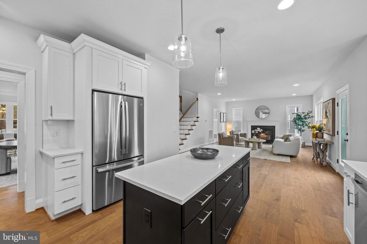 Fireplace, Interior, Kitchen, Living room, Pendant Lights, Recessed Lighting, Stainless Steel Appliances, Wood Texture Flooring