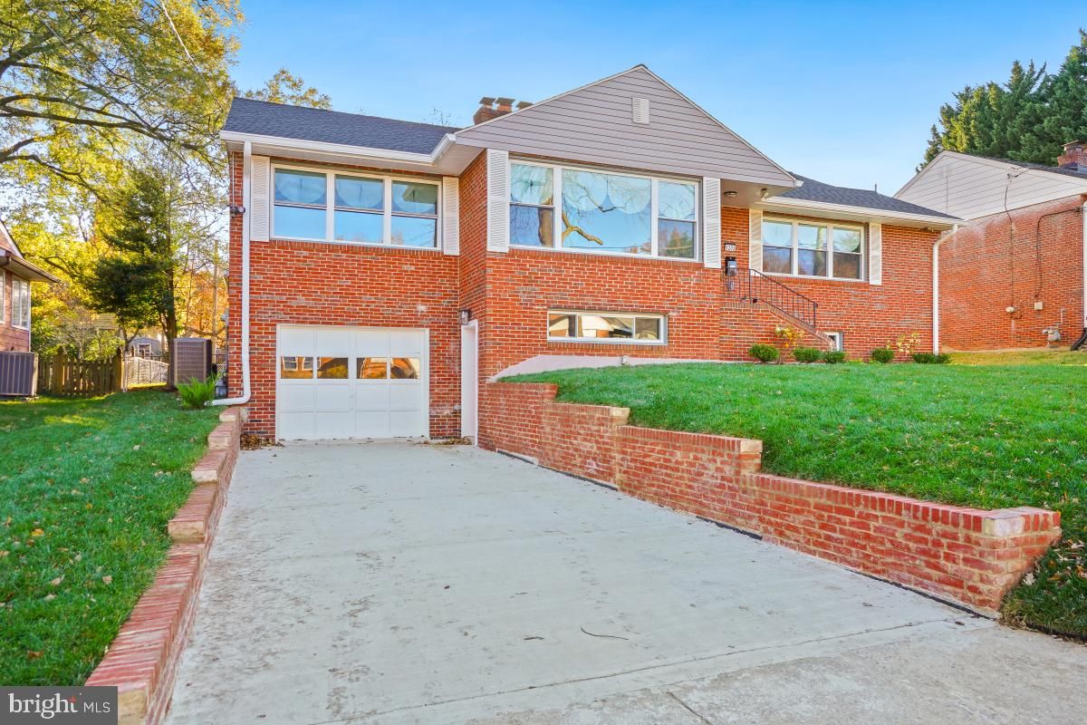 Attached, Backyard, Exterior, Facade, Brick Facade, Tudor Revival