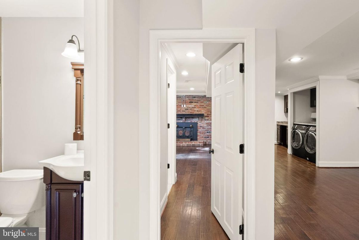 Fireplace, Interior, Recessed Lighting, Stone Walls, Utility Closets, Washer, Wood Texture Flooring