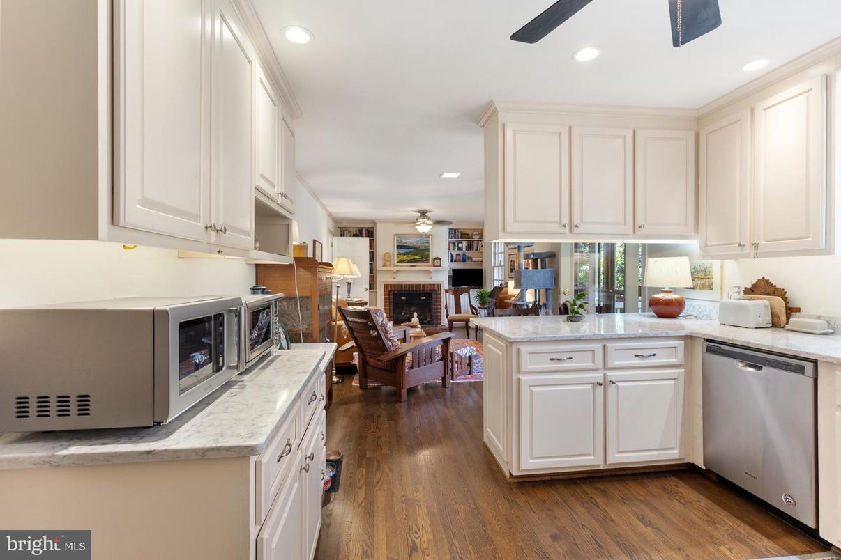 Dining room, Fireplace, Interior, Kitchen, Living room, Recessed Lighting, Wood Texture Flooring