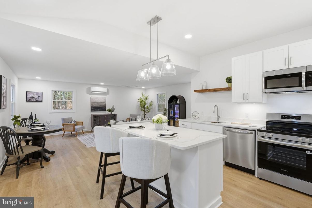Dining room, Fireplace, Interior, Kitchen, Pendant Lights, Recessed Lighting, Stainless Steel Appliances, Wood Texture Flooring