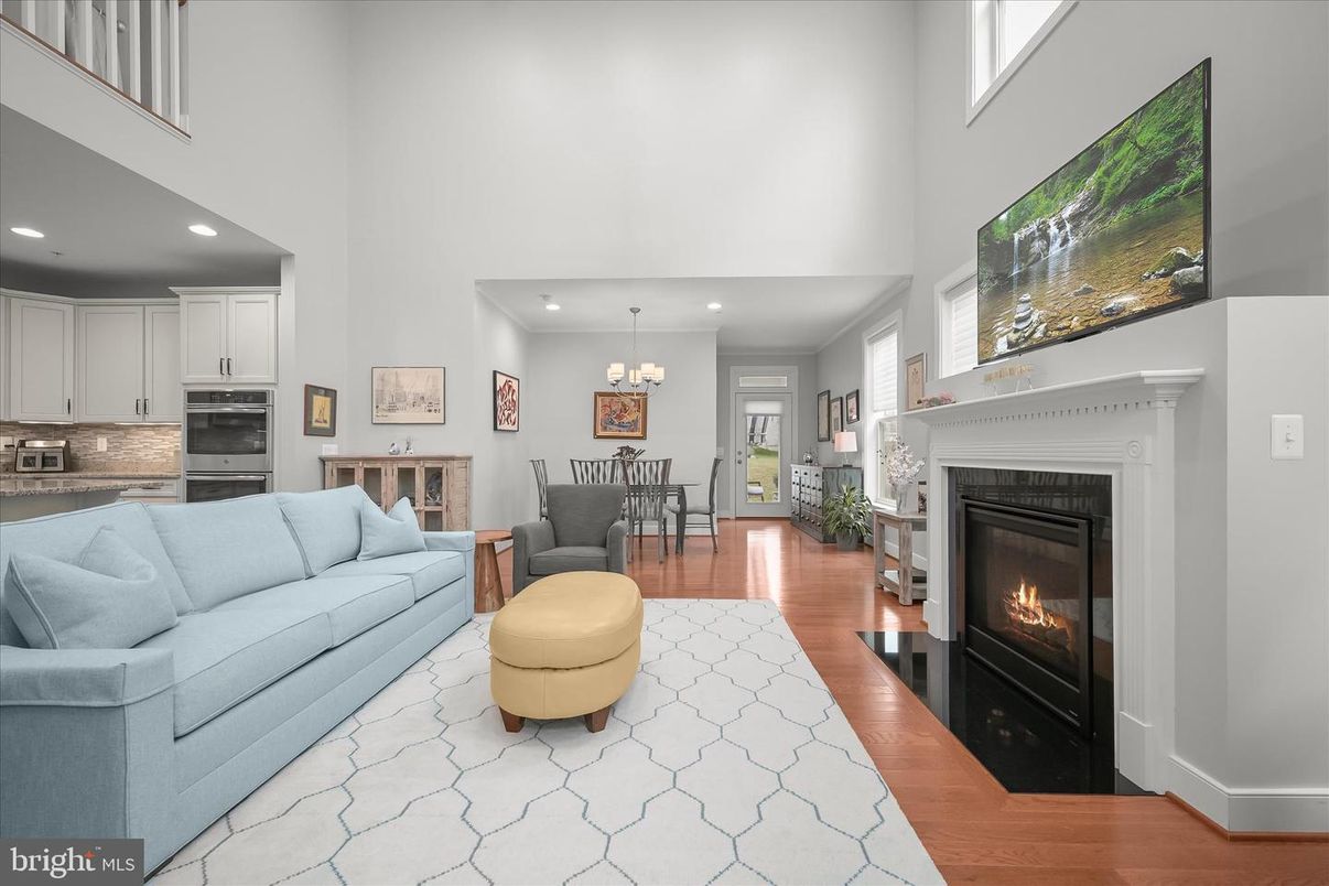 Chandelier, Dining room, Fireplace, Interior, Kitchen, Living room, Recessed Lighting, Wood Texture Flooring