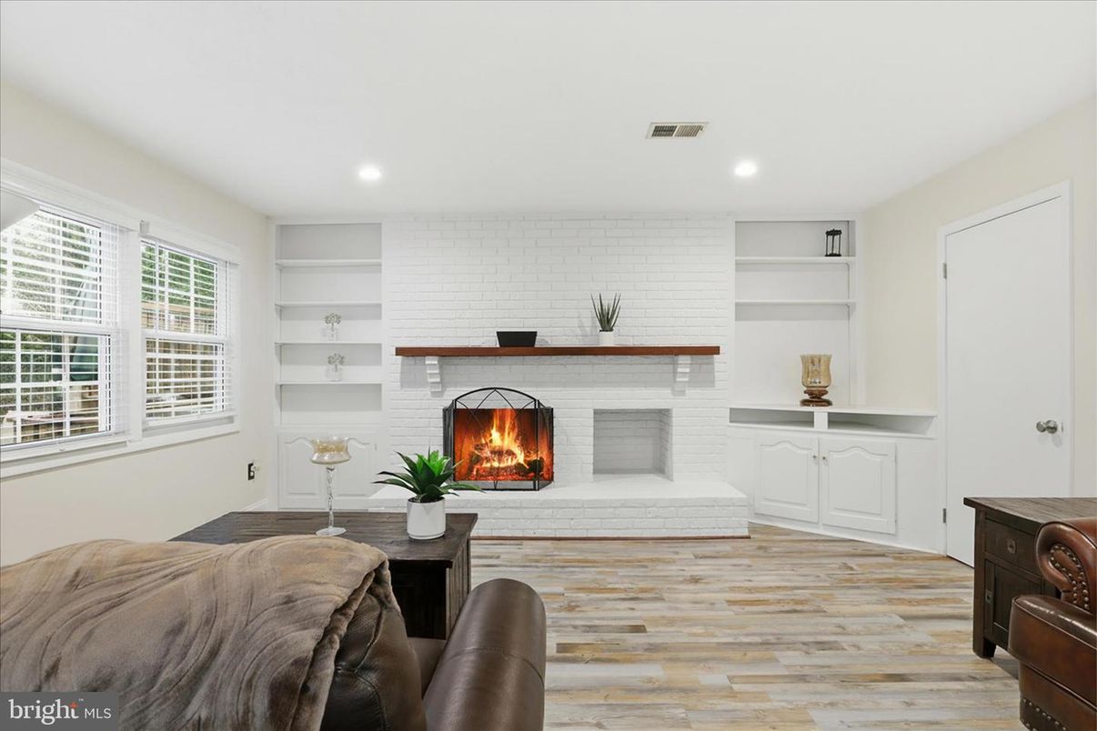 Fireplace, Interior, Living room, Recessed Lighting, Stone Walls, Wood Texture Flooring