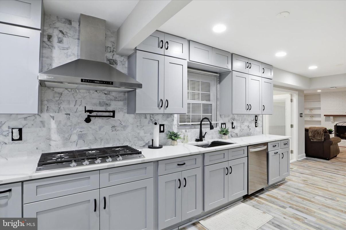 Interior, Kitchen, Marble Walls, Recessed Lighting, Stainless Steel Appliances, Wood Texture Flooring