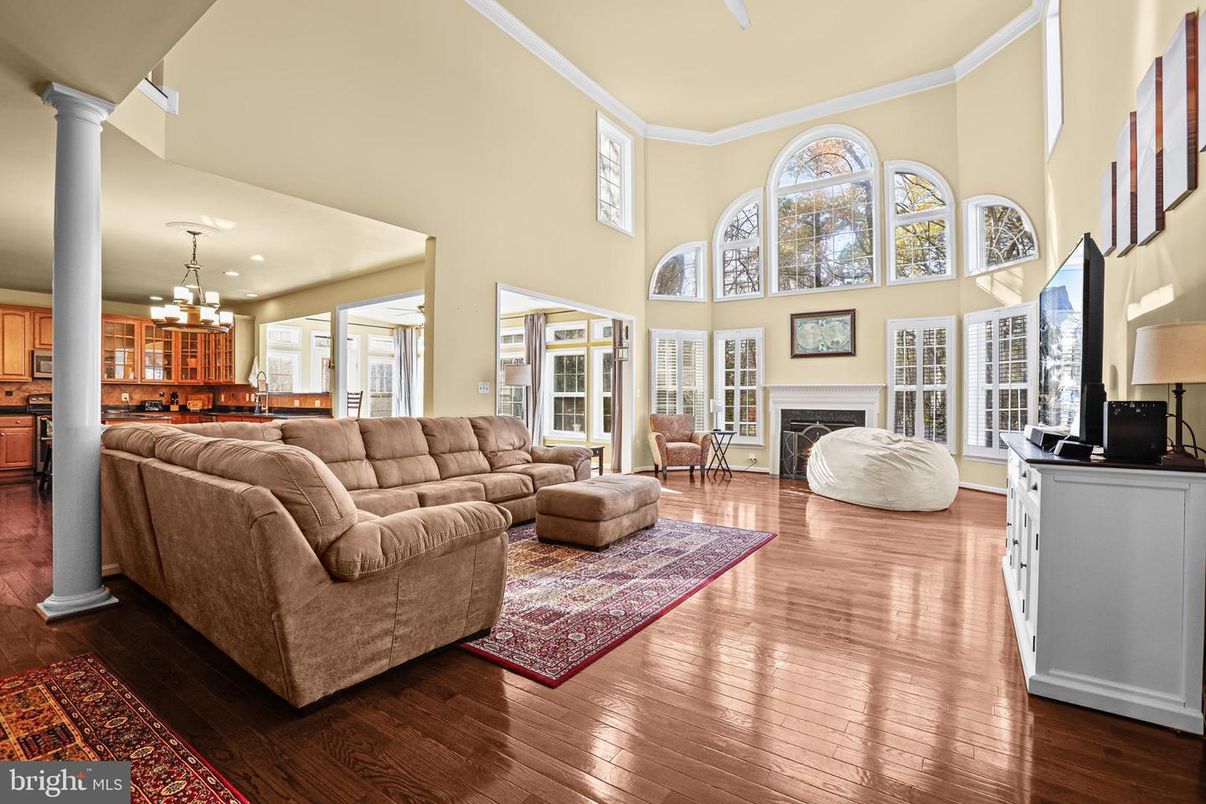 Chandelier, Fireplace, Interior, Kitchen, Living room, Pendant Lights, Recessed Lighting, Wood Texture Flooring