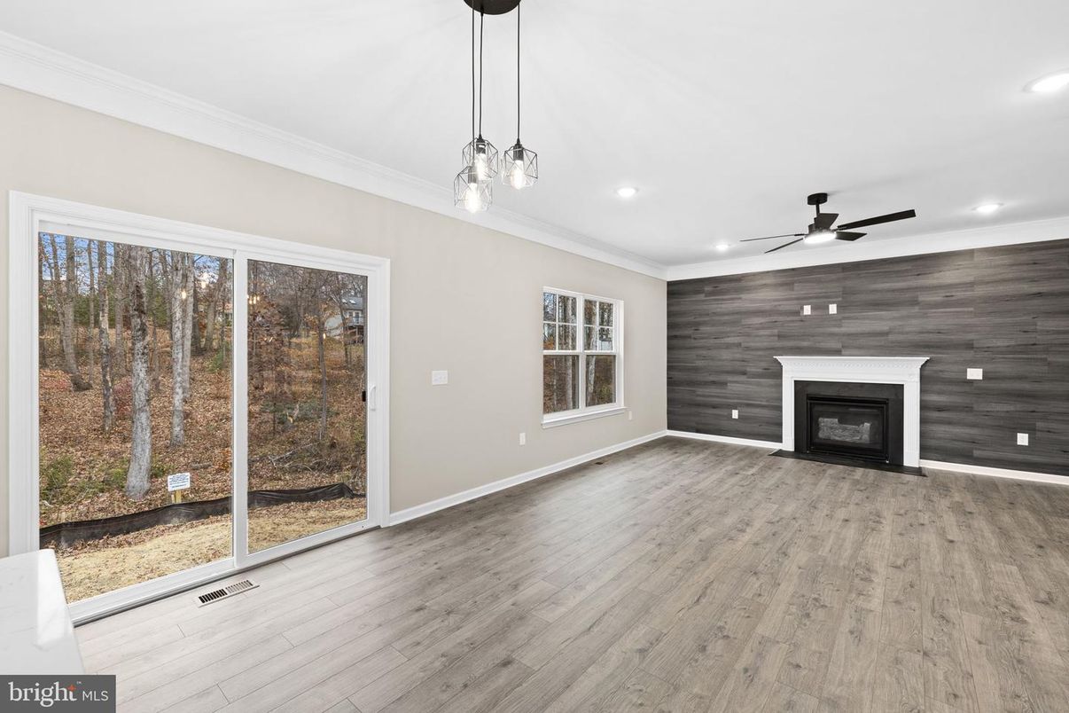 Empty room, Fireplace, Interior, Pendant Lights, Recessed Lighting, Wood Texture Flooring, Wooden Walls