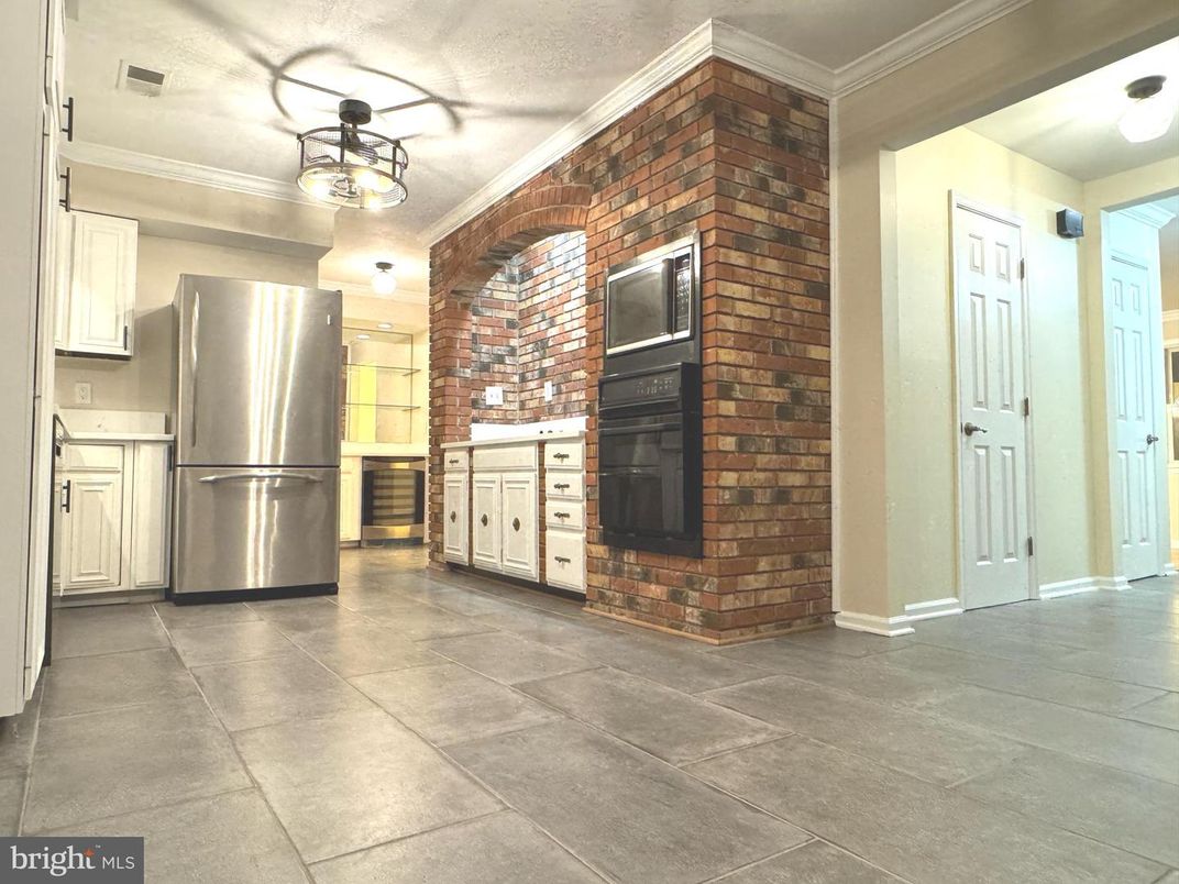 Interior, Kitchen, Stainless Steel Appliances, Stone Walls, Tile Countertops