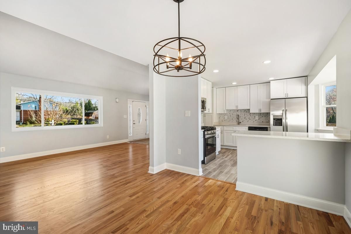 Chandelier, Interior, Kitchen, Pendant Lights, Recessed Lighting, Stainless Steel Appliances, Wood Texture Flooring