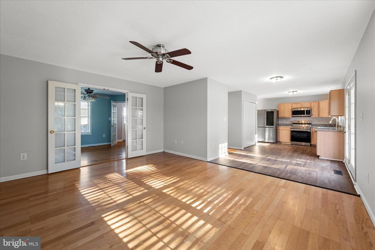 Empty room, Interior, Kitchen, Stainless Steel Appliances, Wood Texture Flooring