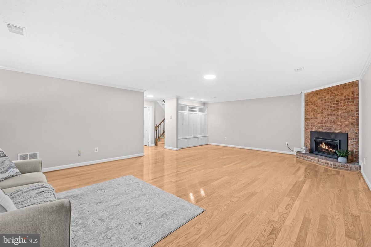 Empty room, Fireplace, Interior, Recessed Lighting, Stone Walls, Wood Texture Flooring