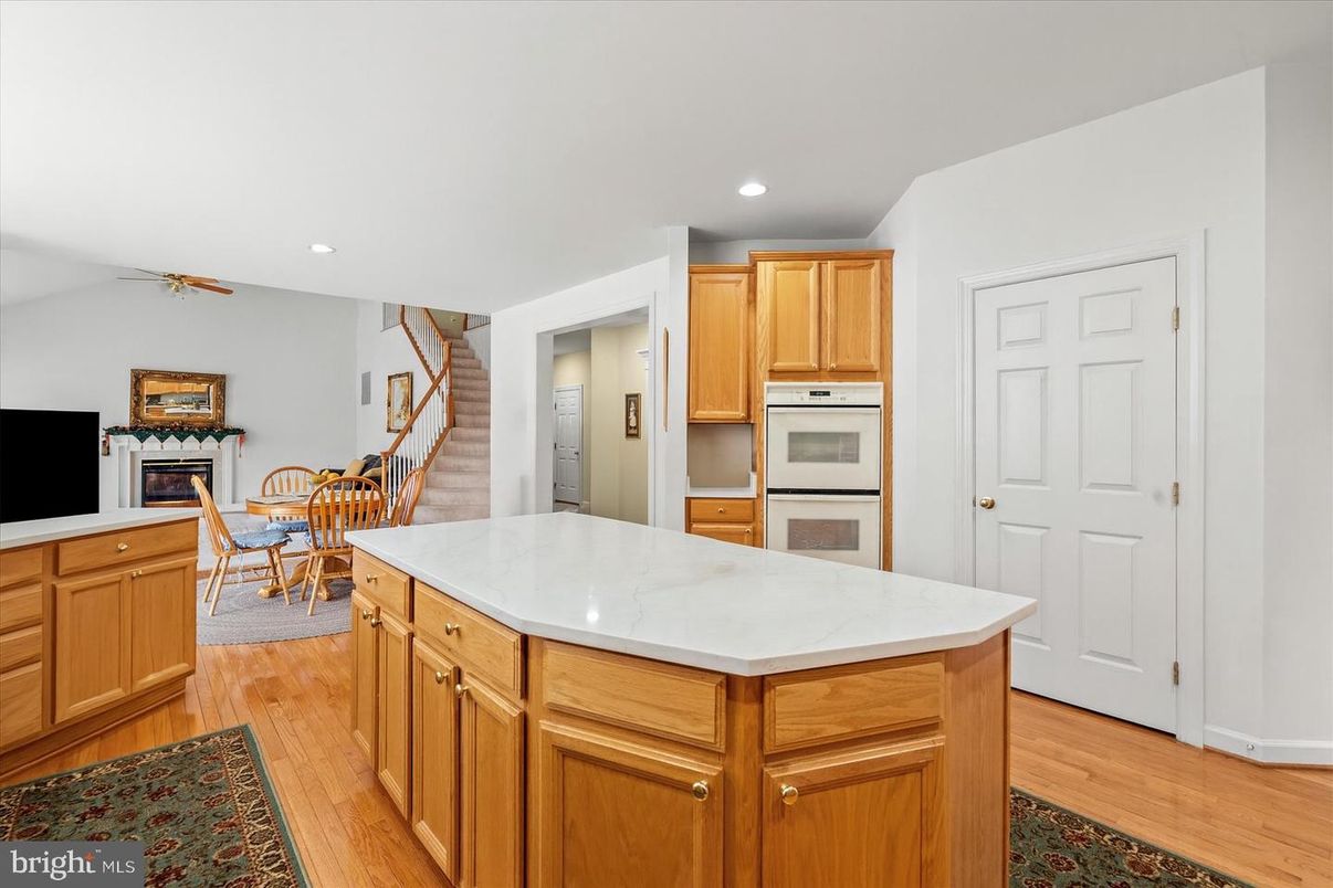 Dining room, Fireplace, Interior, Kitchen, Recessed Lighting, Wood Texture Flooring